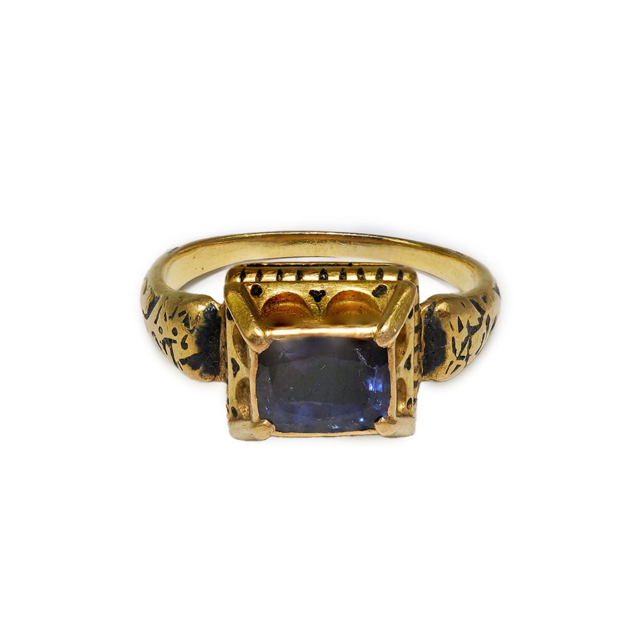 An antique high carat gold, black enamel and collet set cushion cut sapphire set 'poison' ring